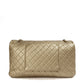 Metallic gold Chanel XXL airline travel flap bag with shoulder strap, showing the back view and sleek design.