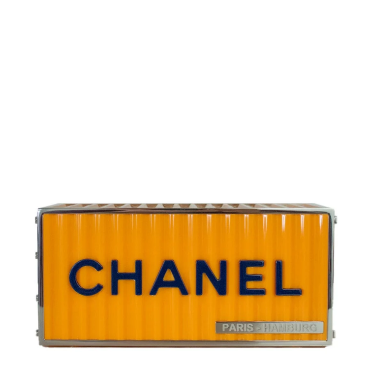 Yellow Chanel Paris Hamburg shipping container minaudière clutch bag with compact, stylish design and metallic clasp detail.