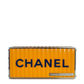 Yellow Chanel Paris Hamburg shipping container minaudière clutch bag with compact, stylish design and metallic clasp detail.
