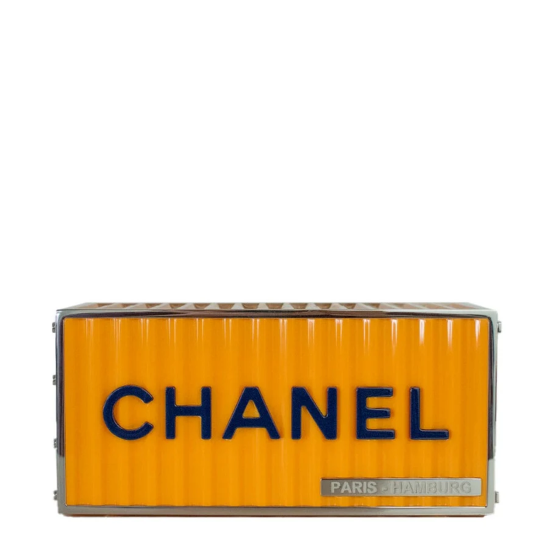 Yellow Chanel Paris Hamburg shipping container minaudière clutch bag with compact, stylish design and metallic clasp detail.