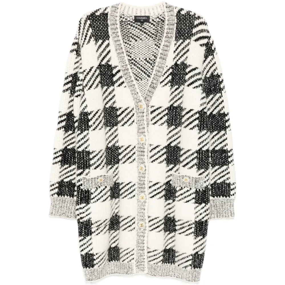 Black and cream houndstooth cashmere blend cardigan by Chanel, longline style, featuring classic pattern and cozy texture.