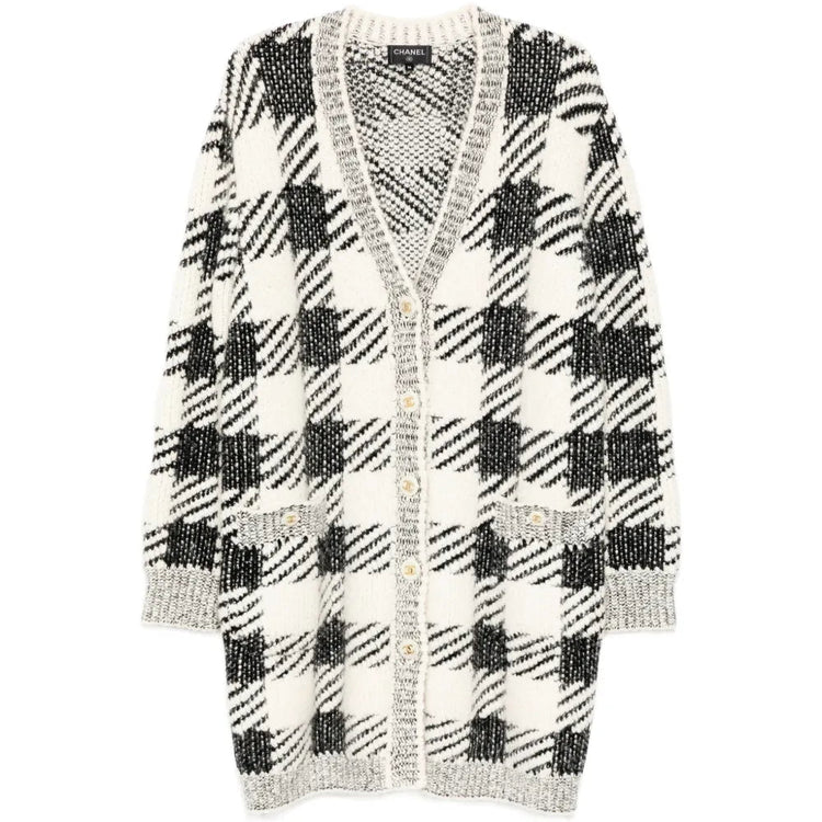 Black and cream houndstooth cashmere blend cardigan by Chanel, longline style, featuring classic pattern and cozy texture.