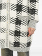 Black and cream houndstooth cashmere blend longline cardigan by Chanel, stylish women&