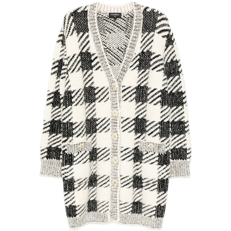 Black and cream houndstooth cashmere blend cardigan by Chanel, longline style, featuring classic pattern and cozy texture.