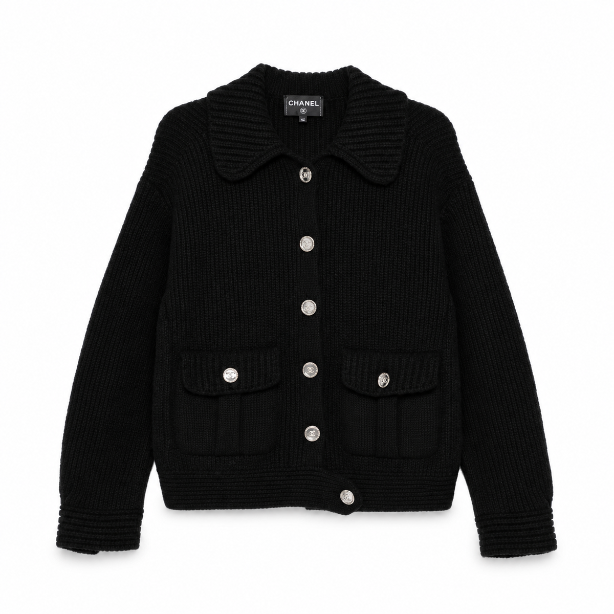 Black cashmere knit cardigan by Chanel, stylish long-sleeve top with a relaxed fit, shown from a side view.