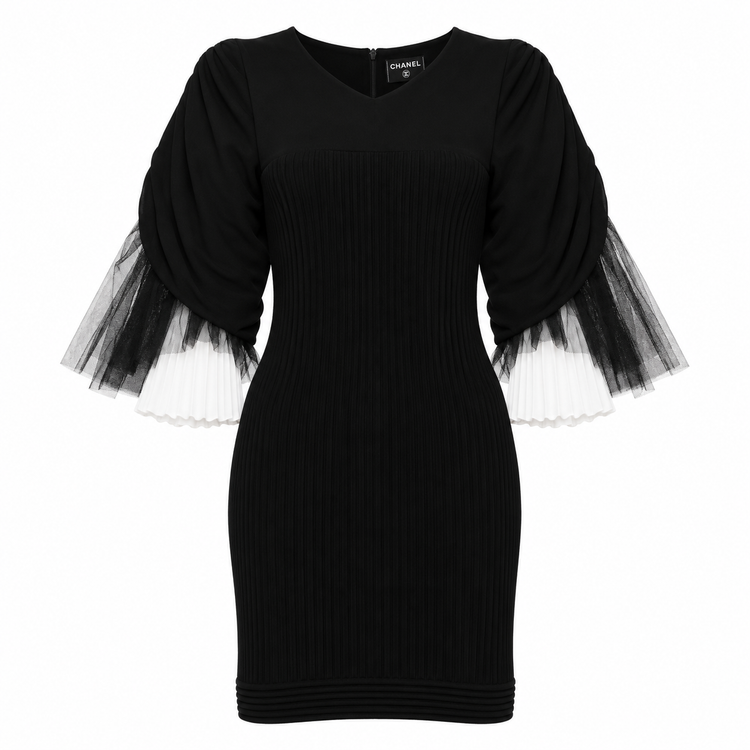 Black Chanel rib knit mini dress with tulle inset details, showcasing a stylish and elegant design perfect for special occasions.