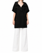 Black Chanel short-sleeved knit gilet, stylish blazer-inspired jacket with a fitted silhouette and classic design.