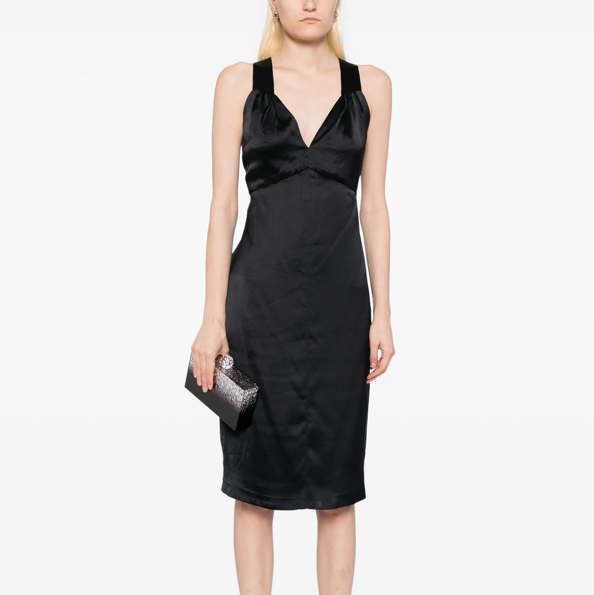 Black silk midi dress by Chanel, featuring elegant design and smooth fabric, perfect for sophisticated occasions.
