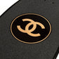 Chanel black skateboard deck with textured grip surface and large gold interlocking CC logo at the centre.
