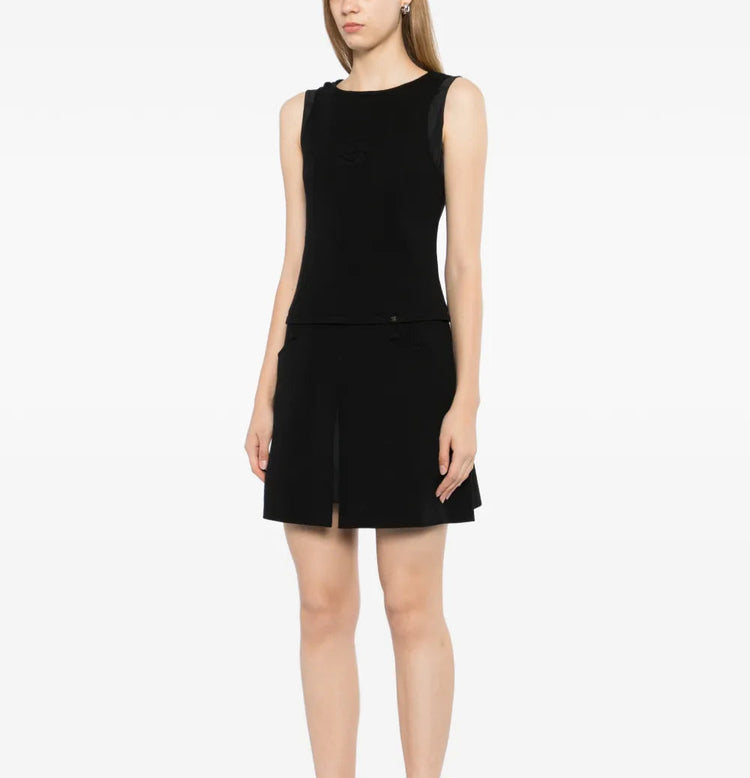 Black Chanel sleeveless Camellia wool mini dress, stylish sleeveless dress with a sleek fit and classic design.