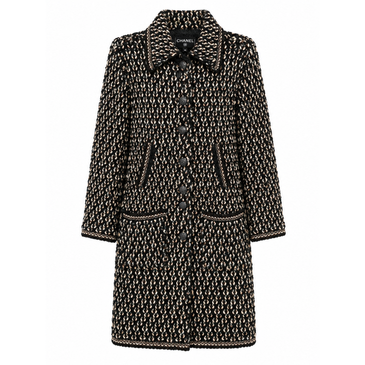 Black tweed coat by Chanel featuring textured fabric and a longline design, perfect for stylish cold-weather wear.