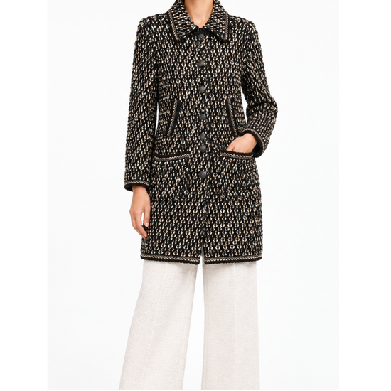 Black Chanel tweed coat with textured fabric and longline silhouette, stylish and elegant outerwear for women.