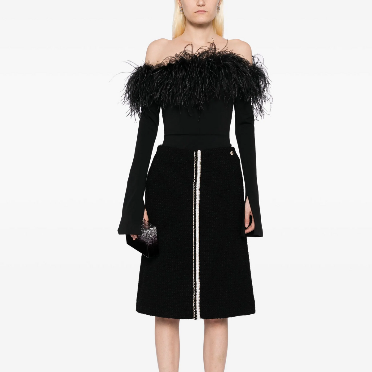 Black tweed skirt by Chanel, knee-length skirt with classic textured fabric, stylish and elegant for sophisticated fashion looks.
