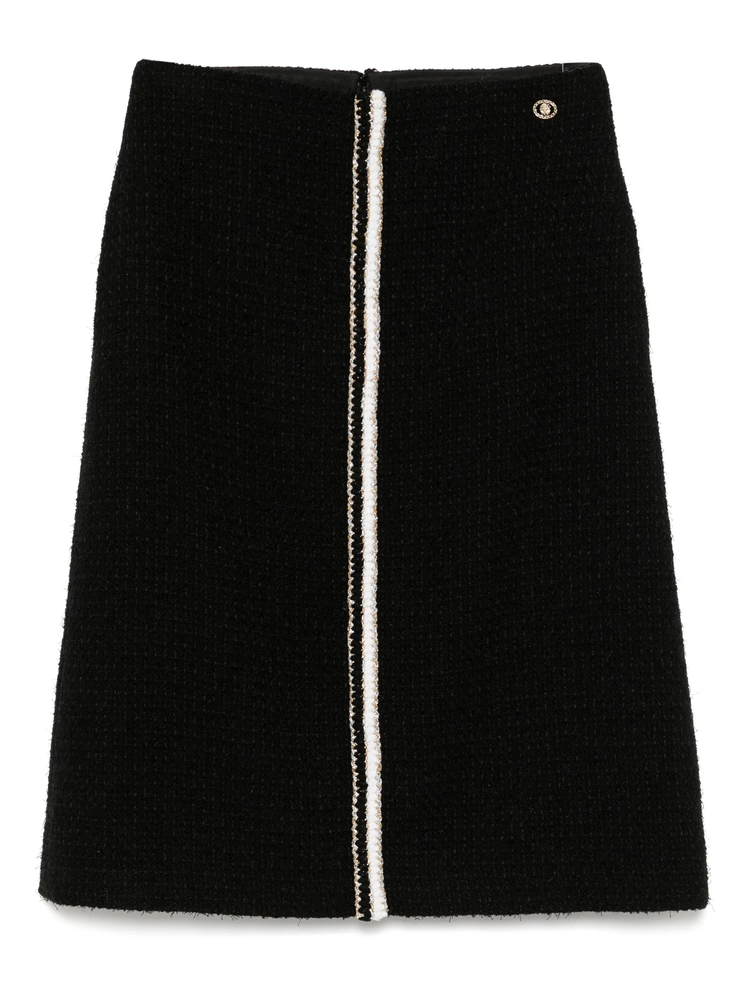 Black tweed skirt by Chanel, knee-length skirt from the 2020 collection, featuring classic tweed fabric and tailored fit.