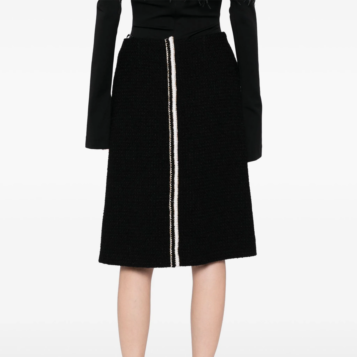 Black tweed skirt by Chanel, knee-length skirt from the 2020 collection, featuring classic textured fabric and tailored fit.