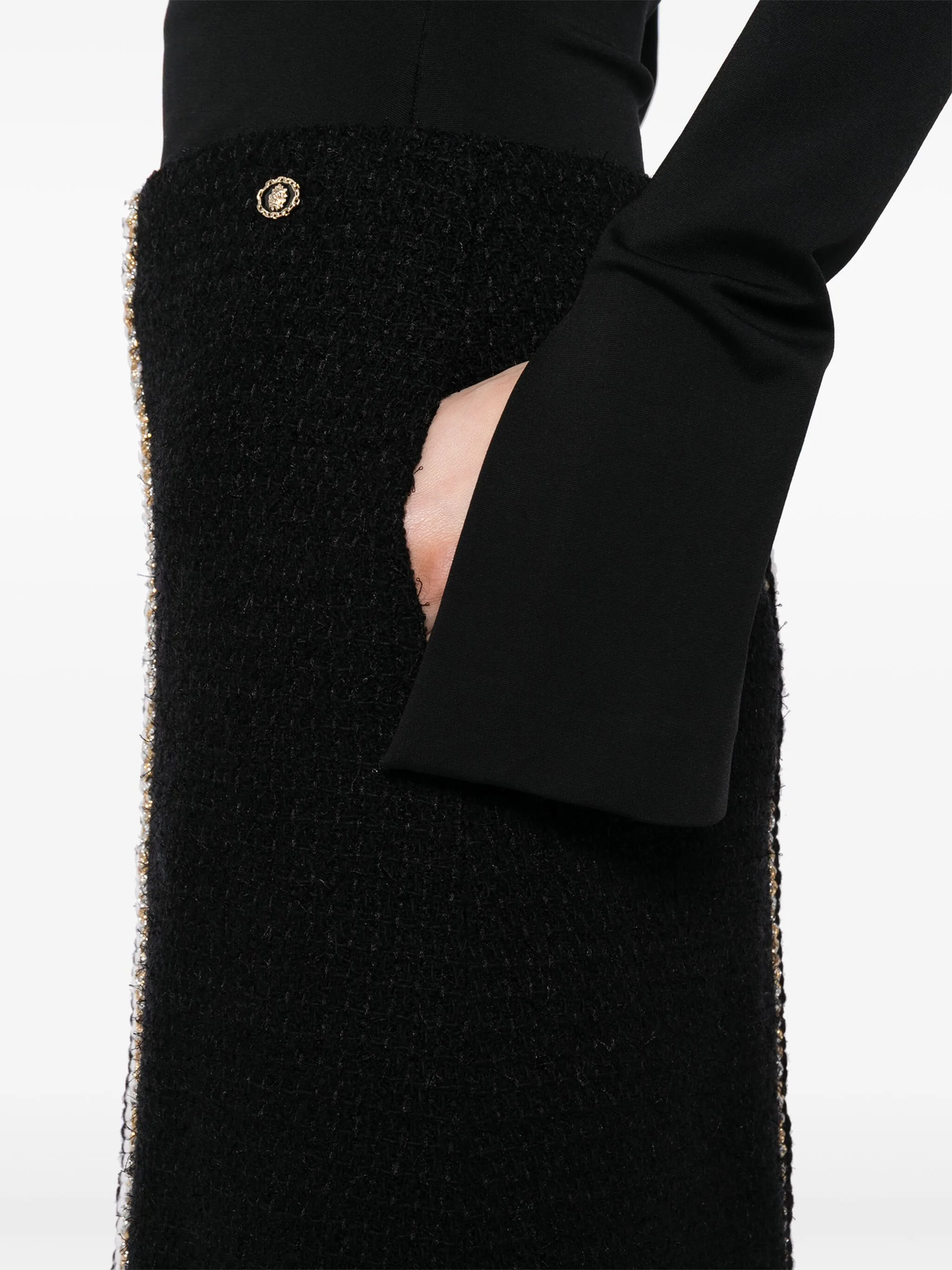 Black tweed skirt by Chanel, knee-length skirt with classic woven texture and tailored fit, perfect for stylish everyday wear.
