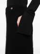 Black tweed skirt by Chanel, knee-length skirt with classic woven texture and tailored fit, perfect for stylish everyday wear.