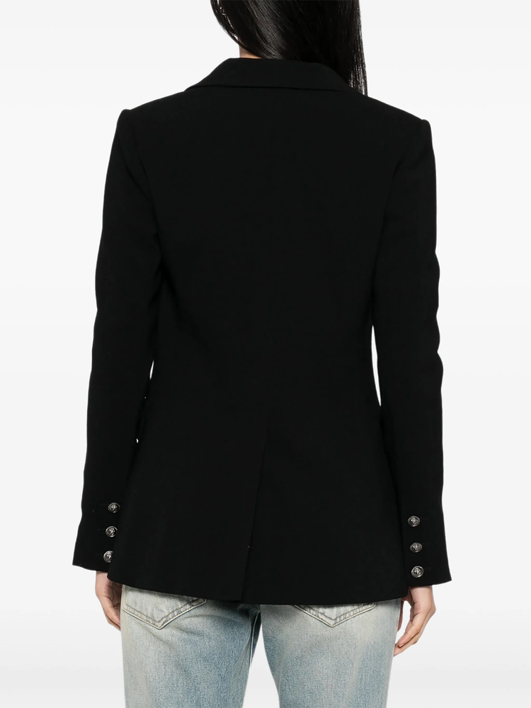 Black wool blazer by Chanel, tailored fit, featuring classic lapels and structured design, perfect for sophisticated, chic outfits.