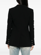 Black wool blazer by Chanel, tailored fit, featuring classic lapels and structured design, perfect for sophisticated, chic outfits.
