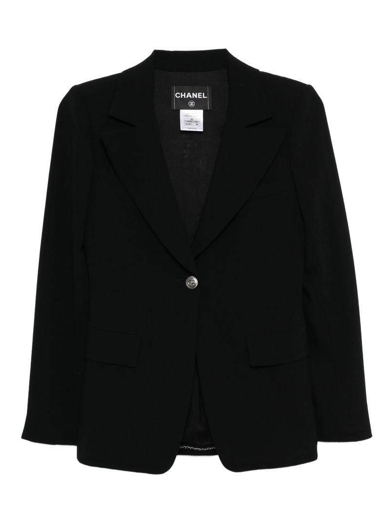 Chanel black wool blazer with tailored fit, classic collar, and button closure, stylish for formal and casual wear.