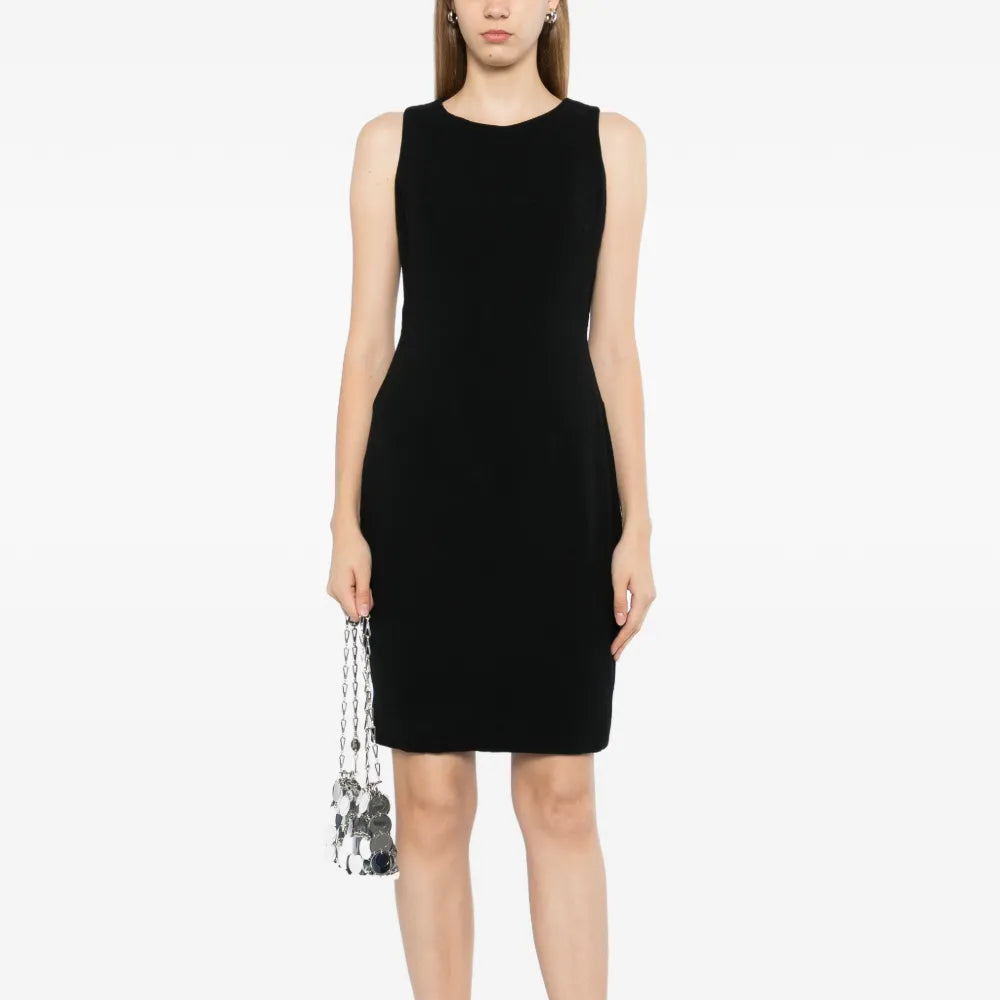 Black wool sleeveless sheath dress by Chanel, tailored fit with classic neckline and sleek design, ideal for elegant occasions.