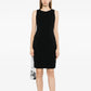 Black wool sleeveless sheath dress by Chanel, tailored fit with classic neckline and sleek design, ideal for elegant occasions.