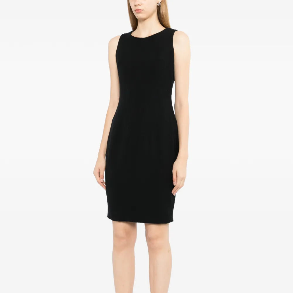 Black wool sleeveless sheath dress by Chanel, tailored fit with a sleek silhouette, displayed on a neutral background.