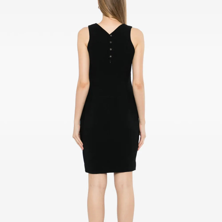 Black wool sleeveless sheath dress by Chanel, showcasing a fitted silhouette and elegant design on a model.