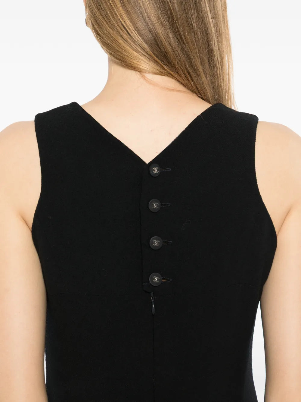 Black wool sleeveless sheath dress by Chanel featuring a fitted silhouette and classic design, perfect for elegant occasions.