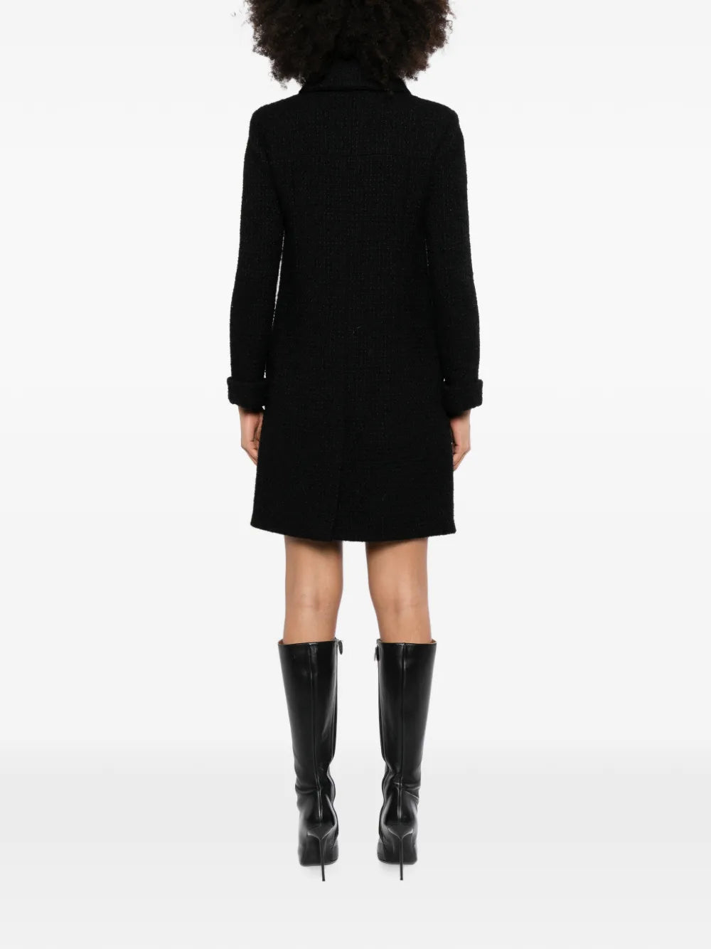 Black Chanel wool tweed coat, stylish and elegant, featuring classic textured fabric and tailored design ideal for sophisticated winter wear.