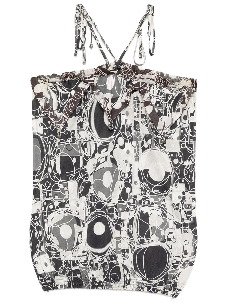 Chanel monochrome printed silk halterneck top with sleek design and elegant drape, showcased on a model.