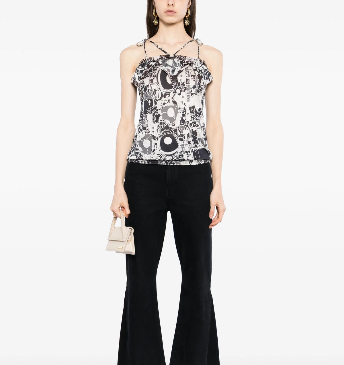 Chanel monochrome printed silk halterneck top with sleek design and stylish pattern, showcased on a model.