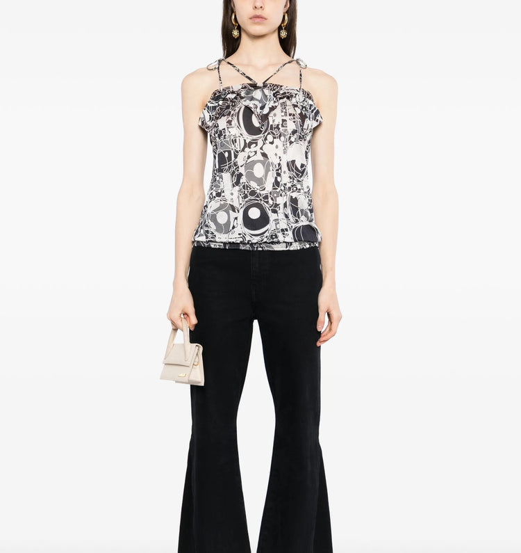 Chanel monochrome printed silk halterneck top with sleek design and stylish pattern, showcased on a model.