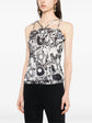 Chanel monochrome printed silk halterneck top with elegant strap design, showcased in a close-up fashion image.