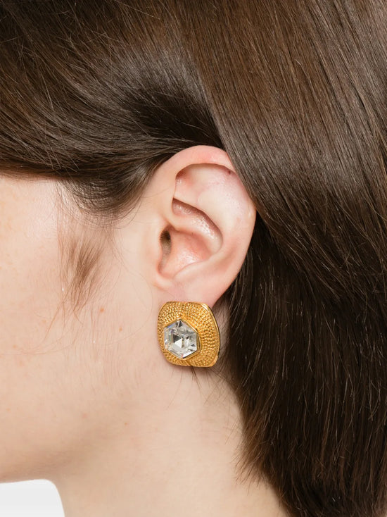 Vintage Chanel clip-on earrings featuring classic design with gold-tone finish and elegant detailing.