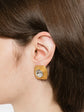 Pair of vintage 1990s Chanel clip-on earrings in gold-plated textured metal centered with large hexagonal clear crystal stones.
