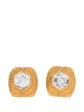 Pair of vintage 1990s Chanel clip-on earrings in gold-plated textured metal centered with large hexagonal clear crystal stones.