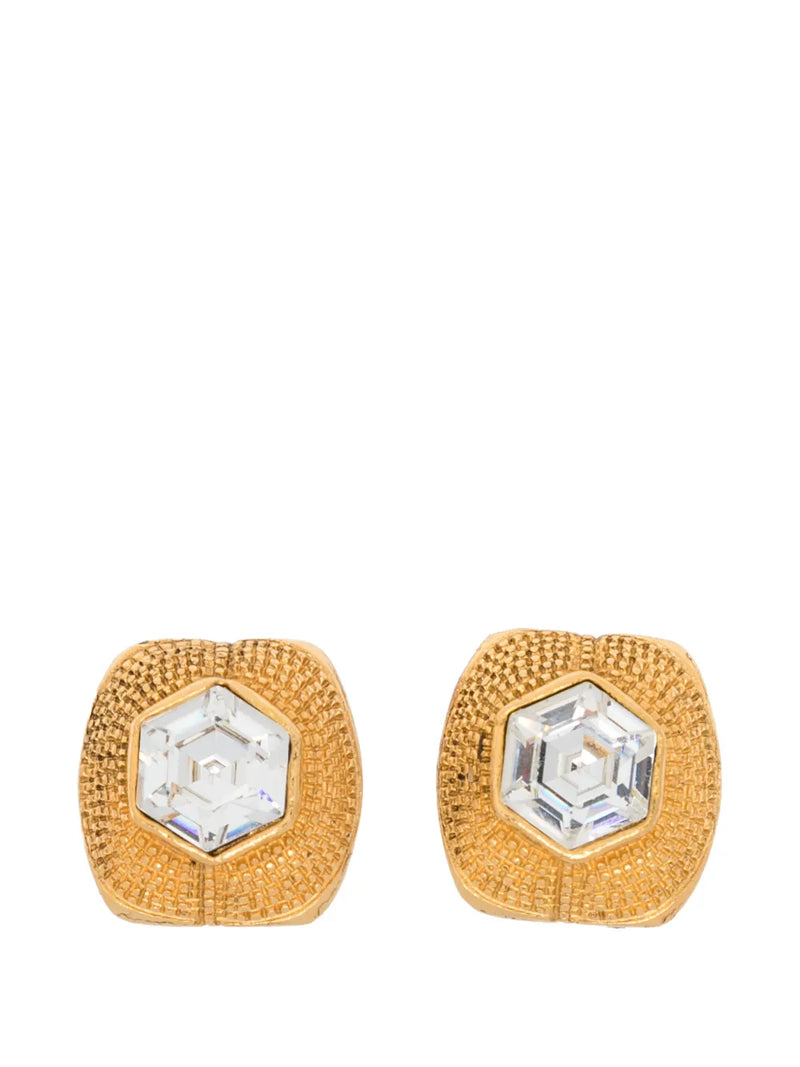 Vintage Chanel clip-on earrings featuring classic gold-tone design and elegant detailing for a timeless accessory.