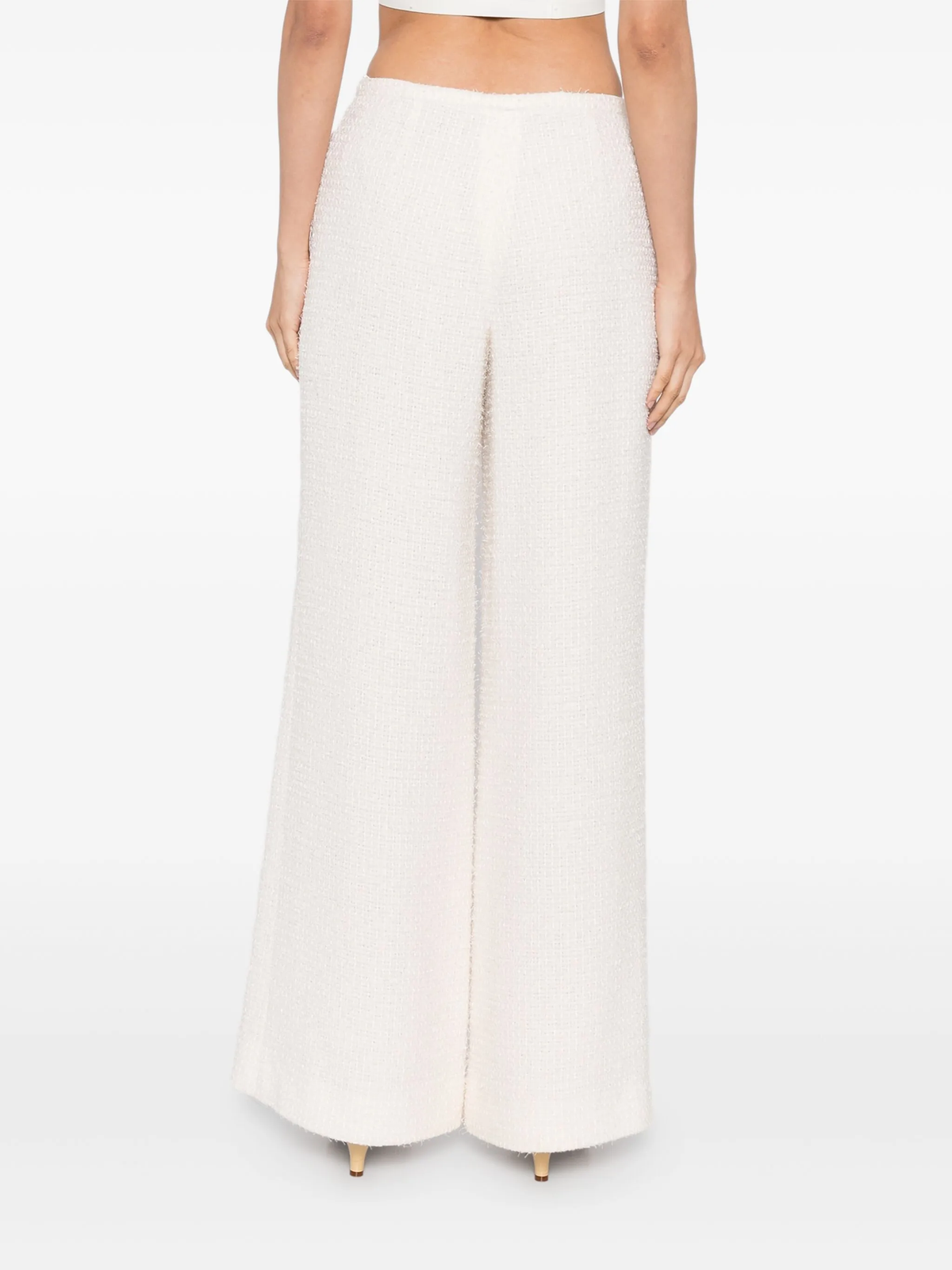 Cream tweed trousers by Chanel, tailored fit with classic textured fabric, stylish and versatile for elegant everyday wear.