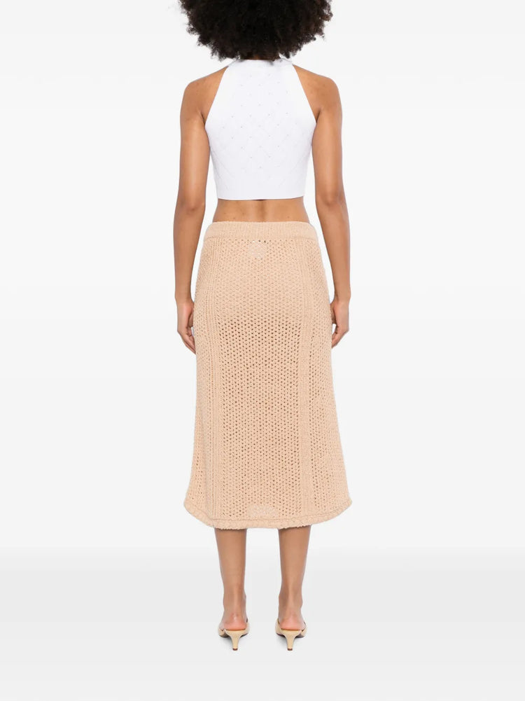 Chanel crochet knit skirt in a stylish, textured design, shown in a close-up image highlighting its intricate knit pattern.