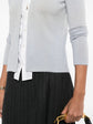 Chanel grey cashmere shirt with a detachable collar, featuring long sleeves and a classic, elegant design.