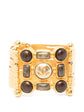 Vintage Chanel wide gold-plated cuff bracelet featuring amber Gripoix glass cabochons and a central frosted medallion with the interlocking CC logo.
