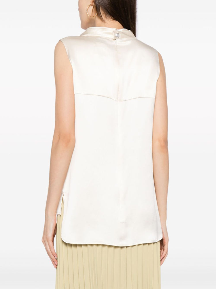Ivory Chanel sleeveless silk satin mock-neck top, close-up view showcasing smooth fabric and elegant design.