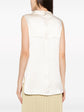 Ivory Chanel sleeveless silk satin mock-neck top, close-up view showcasing smooth fabric and elegant design.