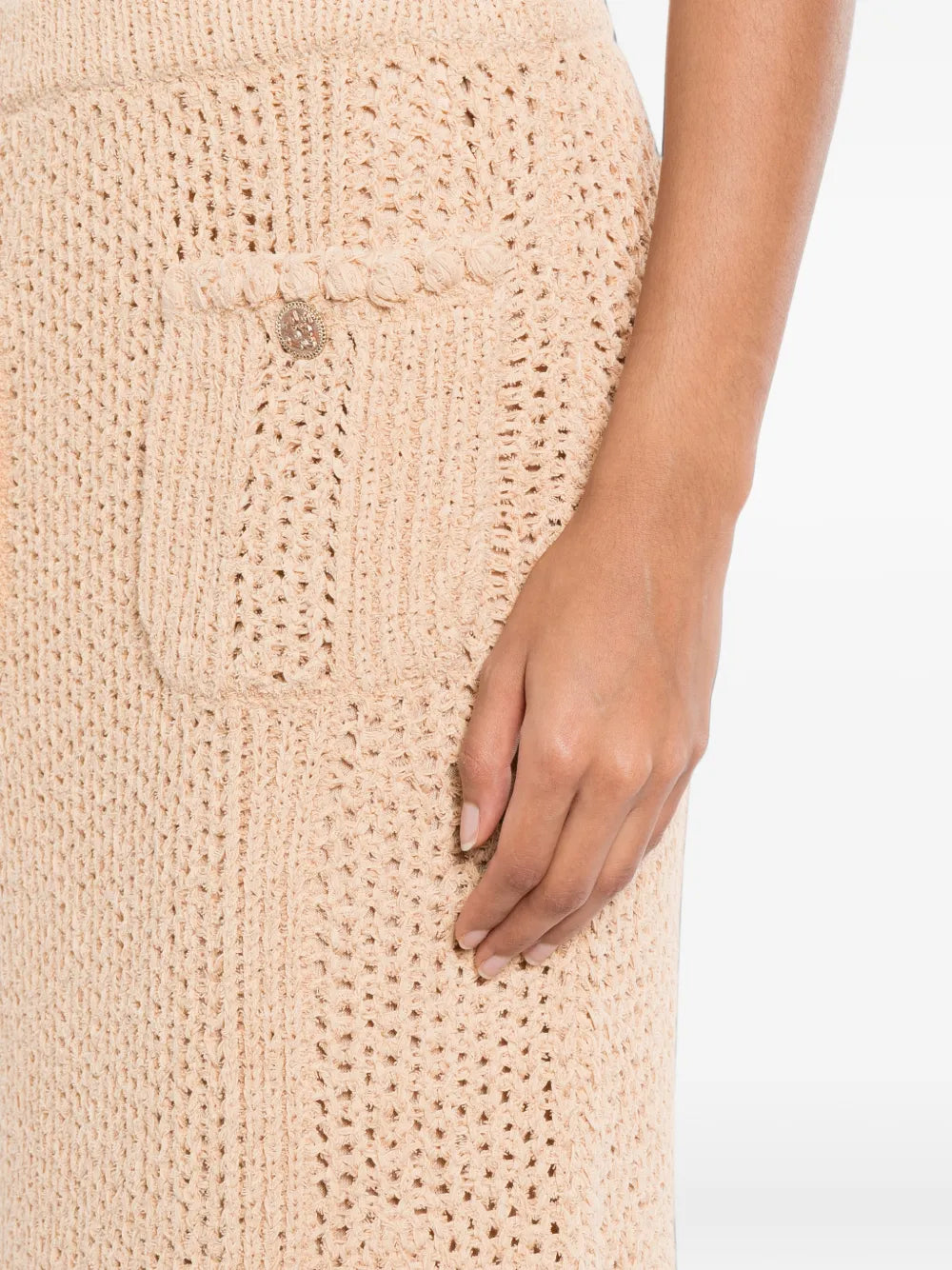 Chanel crochet knit skirt showing intricate textured pattern and classic high-waisted design for a stylish look