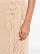 Chanel crochet knit skirt showing intricate textured pattern and classic high-waisted design for a stylish look