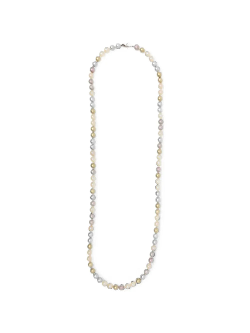 Chanel long pearl sautoir necklace with elegant string of white pearls and gold-tone chain details.