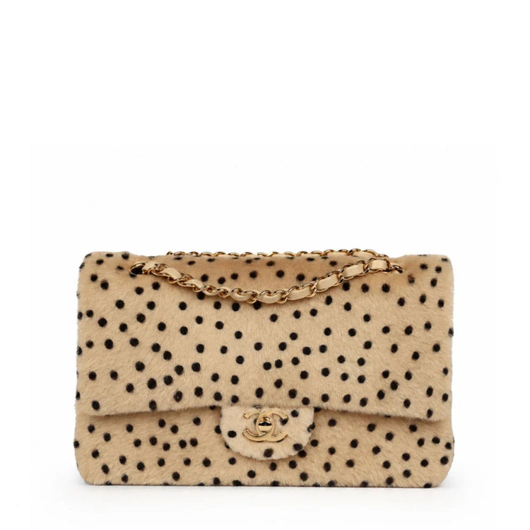 Chanel medium cheetah print flap shoulder bag with gold hardware, showcasing luxurious animal print and elegant design.