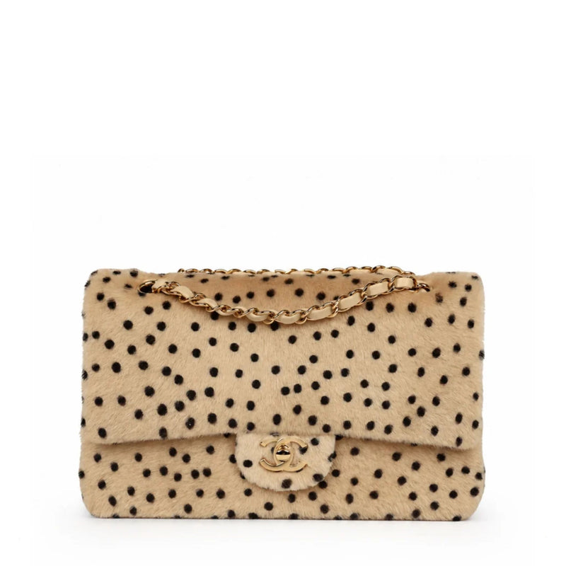 Chanel medium cheetah print flap shoulder bag with gold hardware, showcasing luxurious animal print and elegant design.