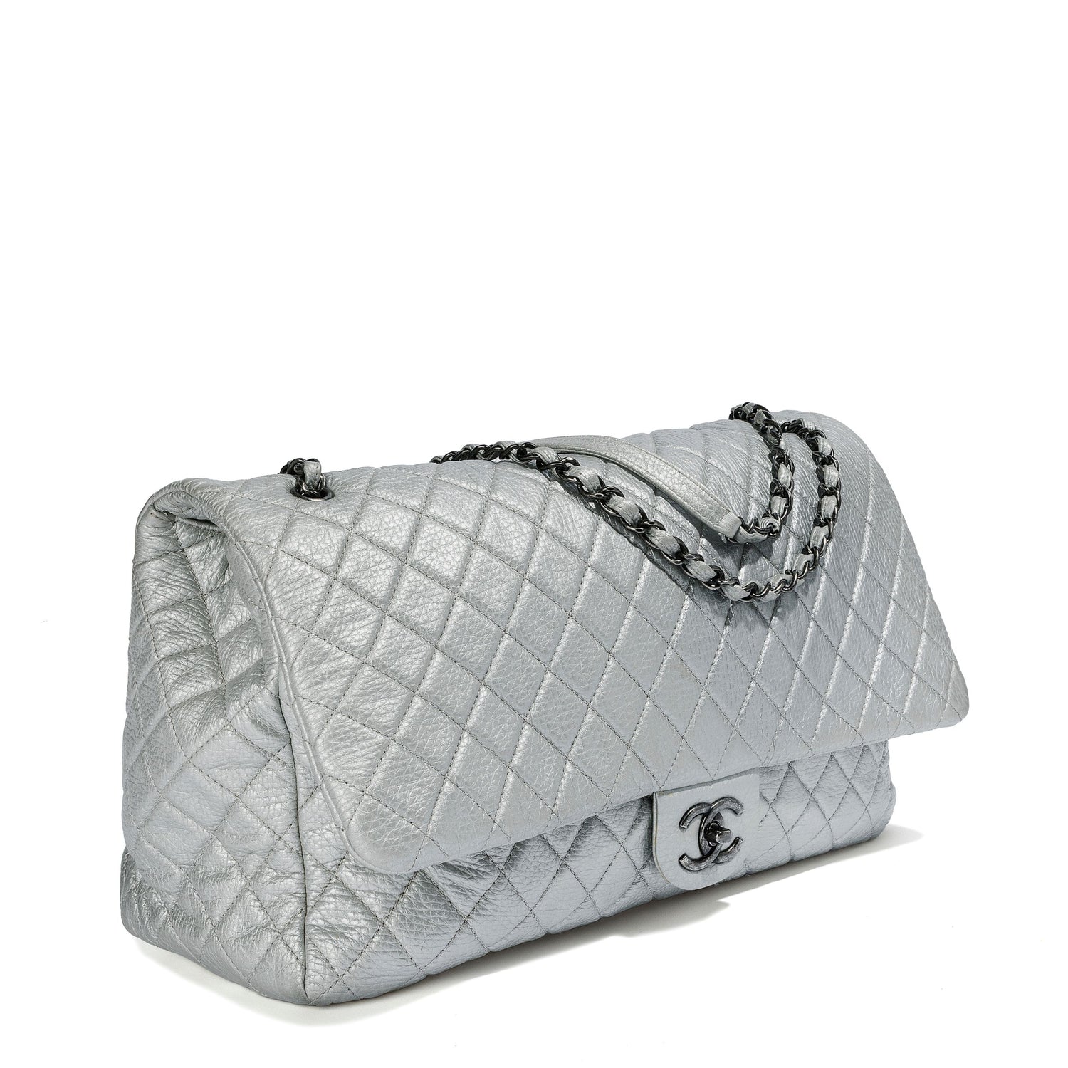 Silver metallic Chanel XXL airline travel flap bag with shoulder strap, side view showing sleek, spacious travel-ready design.